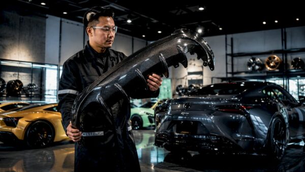 Engineer inspecting Lexus LC500 dry carbon fiber hood