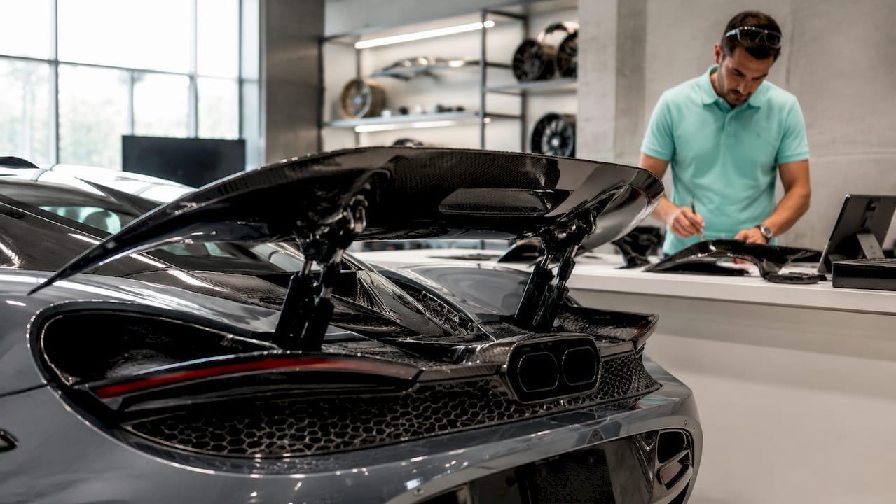 McLaren 750S active rear wing in automotive workshop