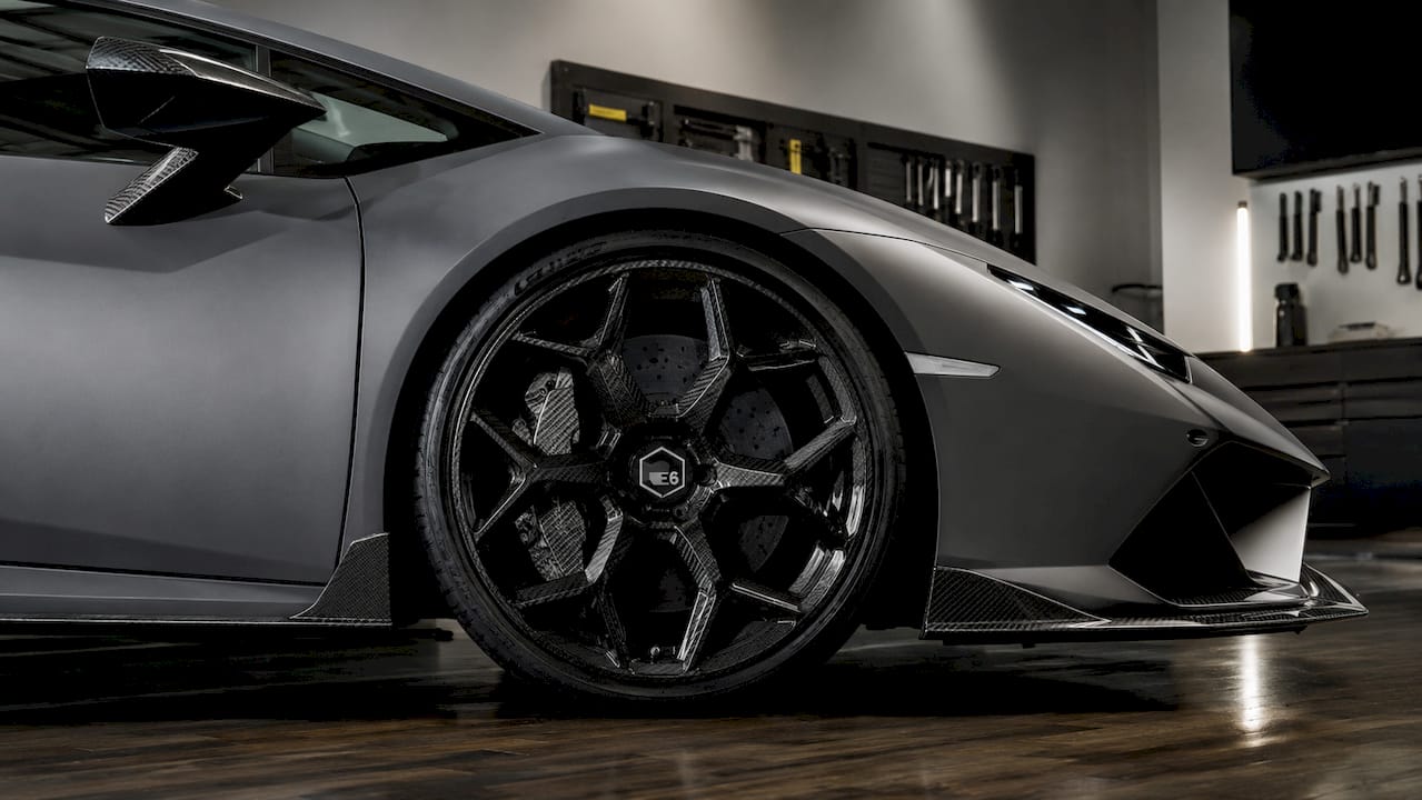 Close-up of forged wheel on Lamborghini Huracán in dark studio