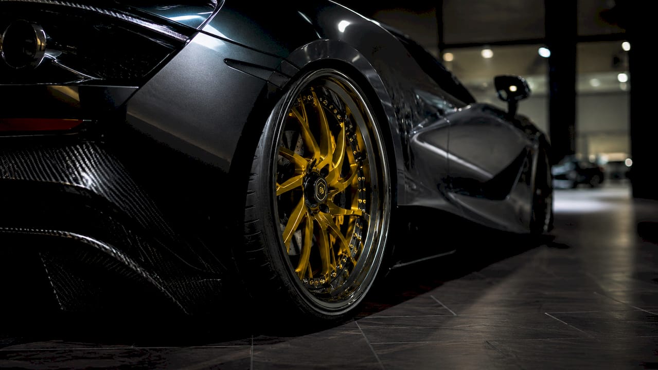 Close-up forged multi-piece wheel on McLaren 720S