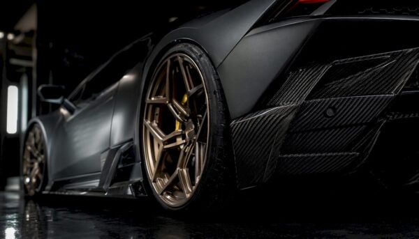Close-up of forged wheel and carbon fiber diffuser