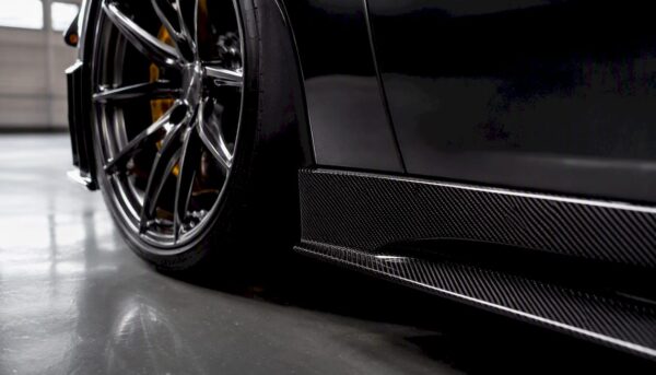 Close-up of forged wheel and carbon fiber diffuser