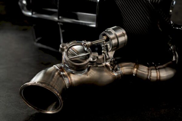 Close-up of valved titanium exhaust pipe