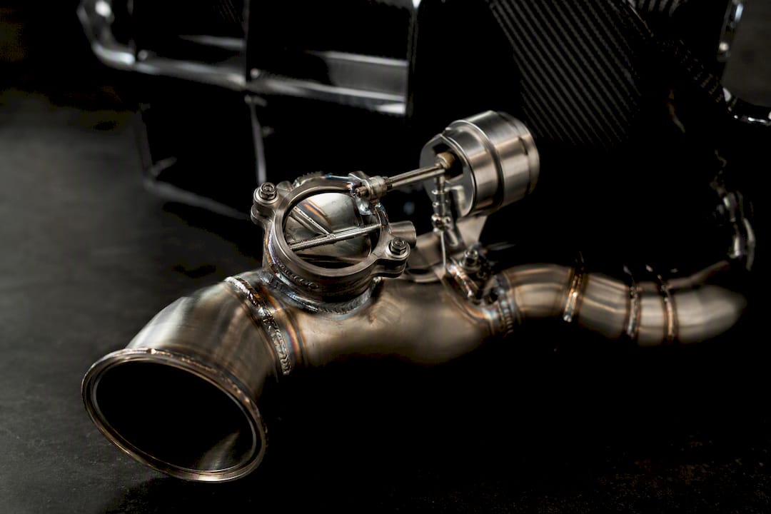 Close-up of valved titanium exhaust pipe