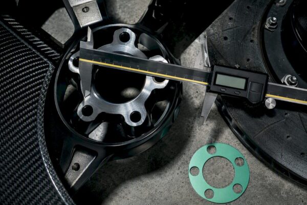 Caliper measuring five-lug wheel pattern