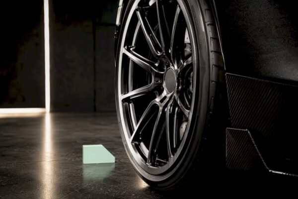McLaren wheel positioned beneath fender