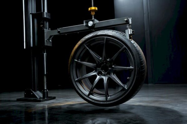 Wheel assembly suspended in torsional pendulum rig