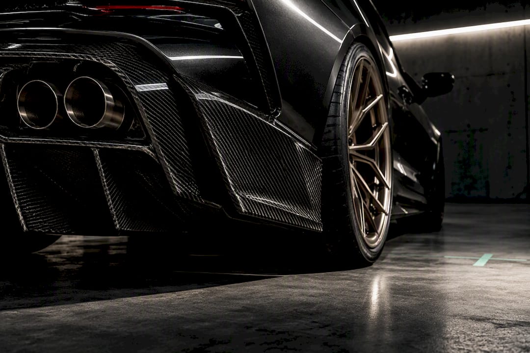 Carbon diffuser, exhaust outlets and forged wheel